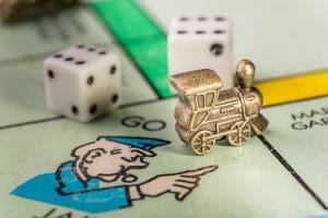 an image of Monopoly - the train is on the go to jail square with dice in the background