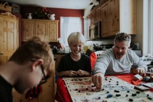 An image of a family playing a board game together.