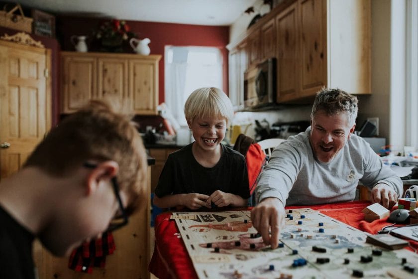 An image of a family playing a board game together.