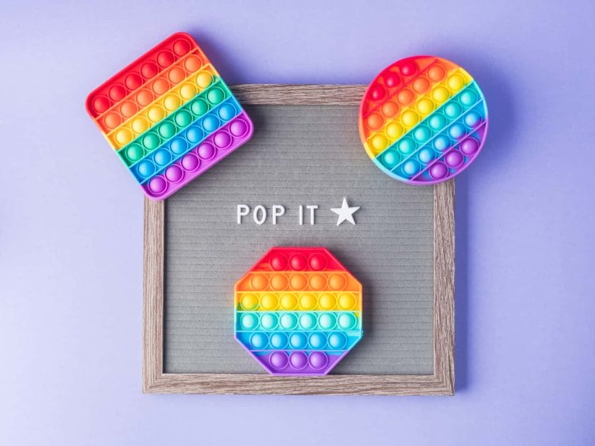 An image of Pop it fidget toys to help reduce stress and anxiety in kids and adults and letter board.