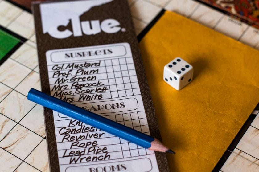 An image of Clue '1972' - The check list of the game with dice and pencil.