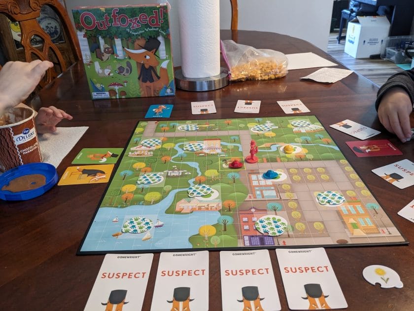 An image from one of our family game nights playing Outfoxed and having snacks.